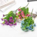 Purple and yellow daisy bouquet green plant synthetic flowers living room