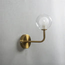 Retro brass curved wall lamp with clear glass ball for bedroom