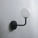 Retro brass curved wall lamp with clear glass ball for bedroom