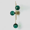 Retro brass wall sconce with 3 glass globes for dining room