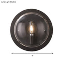 Retro dark gray metal wall sconce with clear glass shade living room