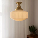 Ribbed cream glass and brass pendant light for dining room