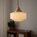 Ribbed cream glass and brass pendant light for dining room