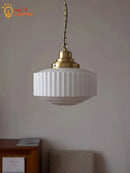 Ribbed cream glass and brass pendant light for dining room