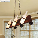 Rustic amber glass island lamp with brown wood arm dining room light