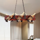 Rustic amber glass island lamp with brown wood arm dining room light