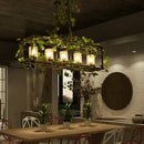 Rustic bronze iron bird cage chandelier dining room greenery light