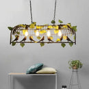 Rustic bronze iron bird cage chandelier dining room greenery light