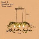 Rustic bronze iron bird cage chandelier dining room greenery light
