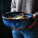 Rustic deep blue ceramic salad bowl with wooden fork dining room