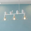 Rustic white bird island light kitchen fixture with clear glass