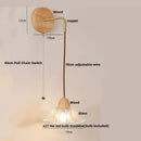 Rustic wood and brass wall light with clear glass pull chain switch