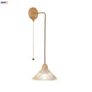 Rustic wood and brass wall light with clear glass pull chain switch