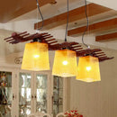 Rustic wood dining room pendant with yellow crackle glass shades