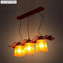 Rustic wood dining room pendant with yellow crackle glass shades