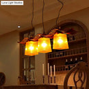 Rustic wood dining room pendant with yellow crackle glass shades
