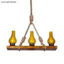 Rustic wooden linear island light with yellow cracked glass kitchen