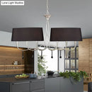 Silver twisted metal island chandelier with dark brown dining room shades