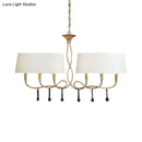 Silver twisted metal island chandelier with dark brown dining room shades