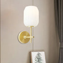 Simple gold light fixture with cream glass shade bedroom wall sconce