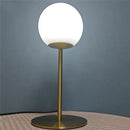 Sleek brass glass ball table lamp for bedroom with frosted shade