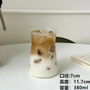 Sleek glass iced latte coffee cup with wood band kitchen tumbler