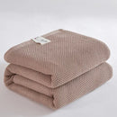 Soft beige cotton honeycomb towel blanket for living room couch
