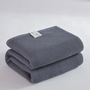 Soft beige cotton honeycomb towel blanket for living room couch