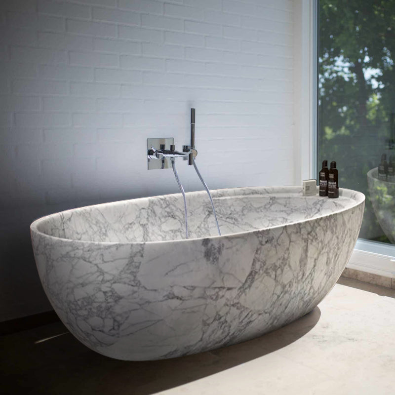Statuario White Marble Bathtub Hand-carved from Solid Marble Block (W)32" (L)68" (H)20" installed modern bathroom next to huge window
