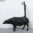 Stylized black matte metal cowherd shepherd boy sculpture living room