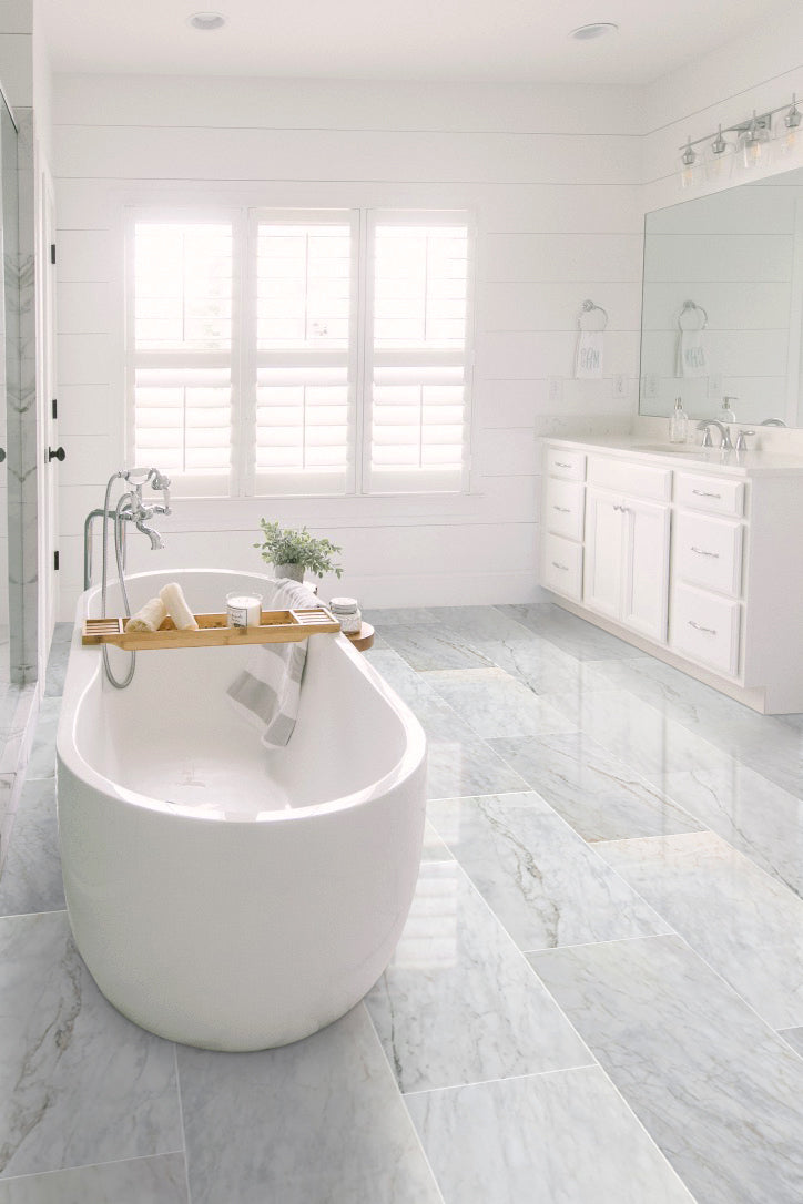 sugar white exotic marble 24x48 polished installed on bathroom floor white bathtub view wide