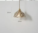 Teal blue glass pendant light with brass hardware for dining room