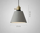 Teal blue glass pendant light with brass hardware for dining room