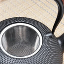 Textured black cast iron tea pot with infuser kitchen steeper