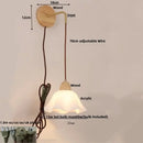 Textured glass and brass wall light fixture for dining room