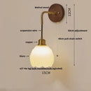 Textured glass and brass wall light fixture for dining room