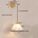 Textured glass and brass wall light fixture for dining room