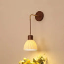 Textured glass and brass wall light fixture for dining room
