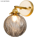 Textured glass ball wall light gold bedroom sconce