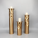 Textured golden metal candlestick holder set for dining room