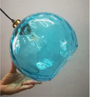 Textured turquoise blue glass ball pendant light for kitchens