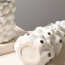 Textured white ceramic vase set with artificial flowers living room