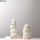 Textured white ceramic vase set with artificial flowers living room