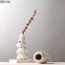 Textured white ceramic vase set with artificial flowers living room