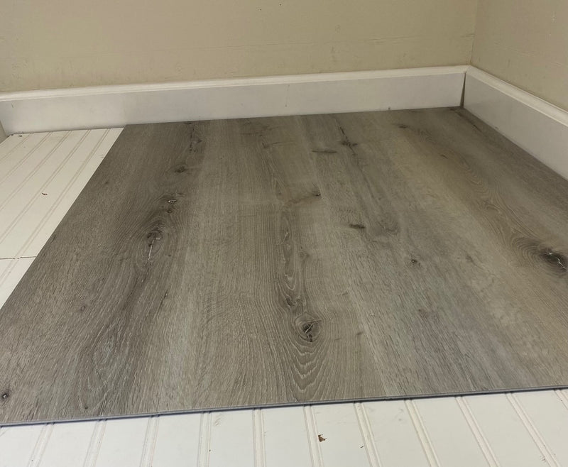 SPC Vinyl Rigid Core 9" Width 48" RL, 6.5mm with attached cushion, Highland Grey Floors - Livfloors Collection plank view angle 