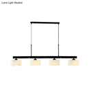 Traditional black drum island pendant with white shades dining room