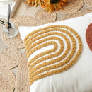 Tufted burnt orange and yellow cushion cover living room