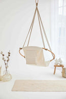 twill natural hanging round chair teak frame product shot back view vase wood side table throw blanket