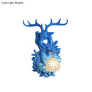 DecorBites™ Loft Style Wall Mounted Sconce with Clear Crystal Shade, Blue/Gold Finish and Deer Head Accent