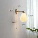 Vintage brass ceramic wall lamp with ribbed glass shade for bedroom